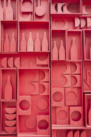 Stylized representation of a small cellar of wine bottles