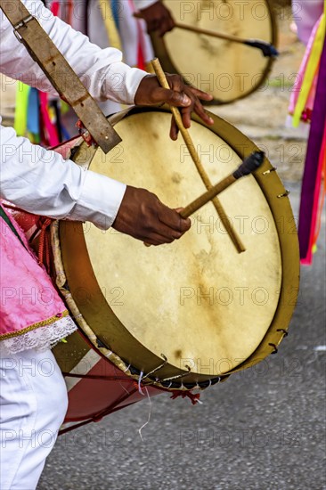 Drummers with colorful musical instruments on the streets of Brazil during a popular festival, Belo horizonte, Minas Gerais, Brazil, South America