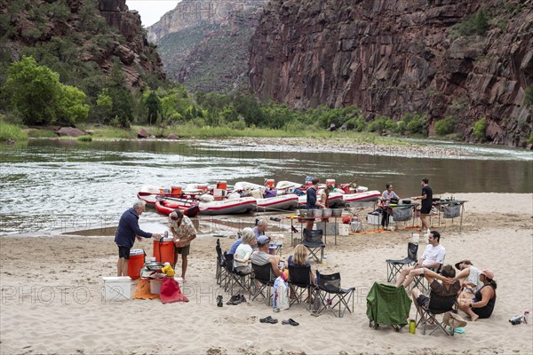 Dinosaur, Colorado, River rafters relax in the evening during a trip on the Green River in Dinosaur National Monument