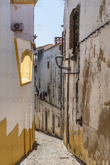 Scenic view of the old town of Elvas in Alentejo, Portugal. Narrow streets of whitewashed white houses