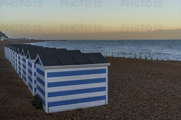 Hastings, East Sussex, England, UK, May 11, 2022: Evening mood on the beach with some beach huts