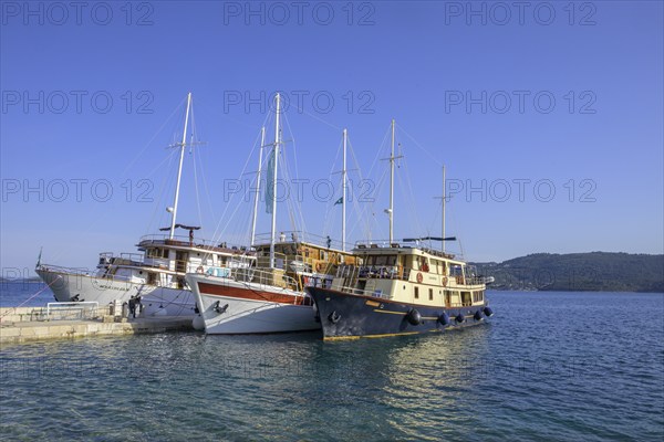 Three ships on the pier, Kucište, Orebic, Pelješac Peninsula, Dubrovnik-Neretva County, Croatia, Europe