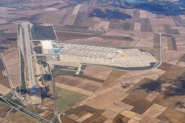 Aerial view of parked commercial aircraft at Teruel Airport in Aragon, parking, storage, scrapping, Airbus, Boeing, Lufthansa, A380, runway, landing strip, Spain, Europe