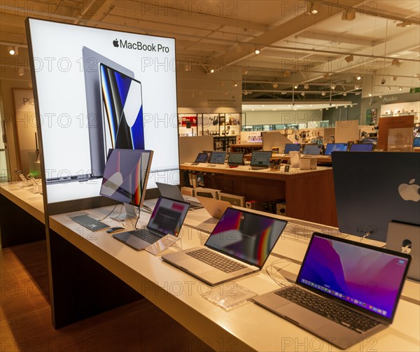 Apple MacBook Pro computers display in John Lewis at Home shop, Ipswich, Suffolk, England, UK