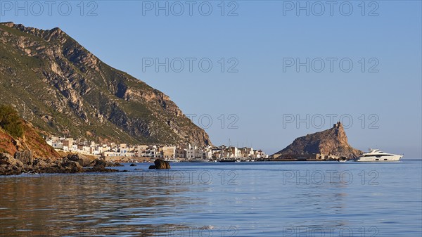 Morning light, luxury yacht, sailing boat, Castello di Punta Troia, harbour, Martettimo town, Marettimo, Egadi Islands, Sicily, Italy, Europe