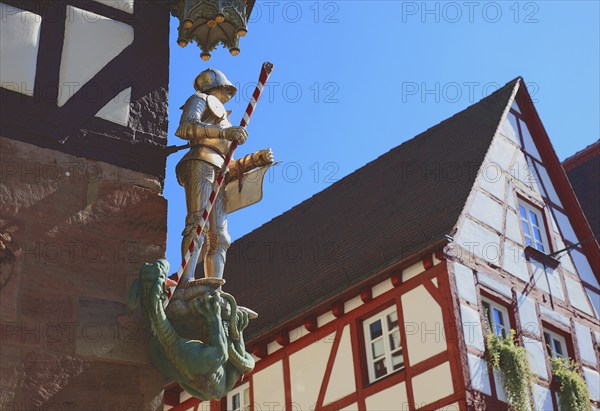 In the historic centre of Nuremberg, St. George as dragon slayer at Pilatus House (left) and houses at Tiergärtnertorplatz, Middle Franconia, Bavaria, Germany, Europe