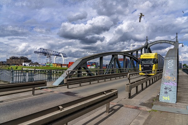 Container terminal at the Rhine port of Krefeld, inland port, 4th largest public port in North Rhine-Westphalia, trimodal handling of goods, goods, containers, general cargo, swing bridge over the harbour basin, North Rhine-Westphalia, Germany, Europe