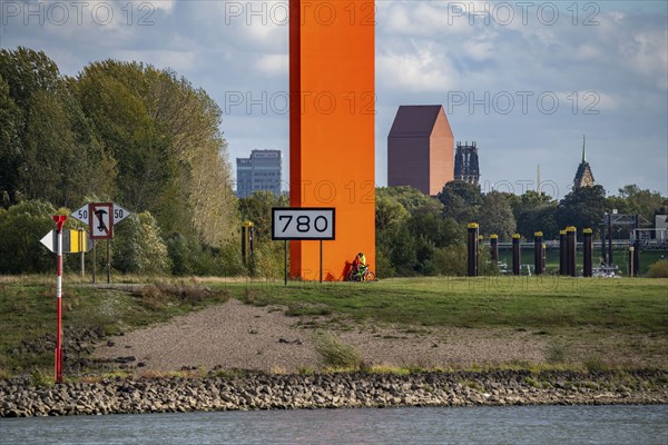 The sculpture Rhine Orange at the mouth of the Ruhr into the Rhine, skyline of the city centre of Duisburg, tower of the North Rhine-Westphalia State Archive, town hall tower and Salvator Church, North Rhine-Westphalia, Germany, Europe