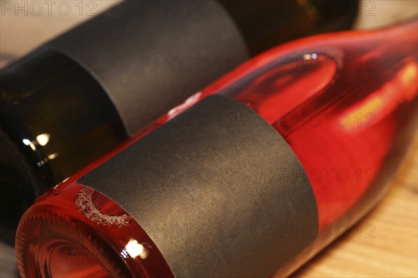 Close-up of two horizontal wine bottles