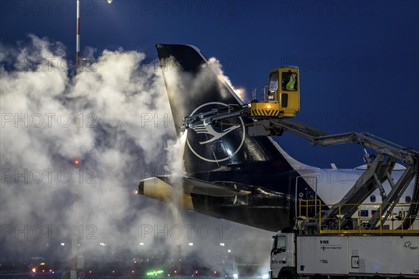 Winter at Frankfurt Main Airport, FRA, Lufthansa aircraft being de-iced by de-icing vehicles, Hesse, Germany, Europe