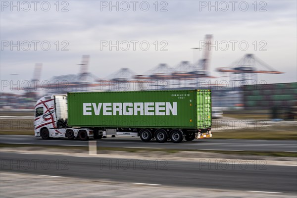 Container lorry, bringing containers to Euromax Container Terminal, the seaport of Rotterdam, Netherlands, deep-sea port Maasvlakte 2, on a man-made land area off the original coastline