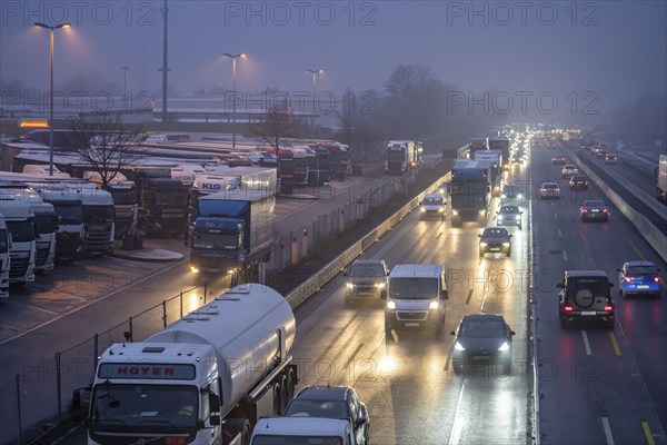 Heavy traffic on the A2 at the Bottrop-Süd service area, overcrowded lorry parking in the evening, Bottrop, North Rhine-Westphalia, Germany, Europe