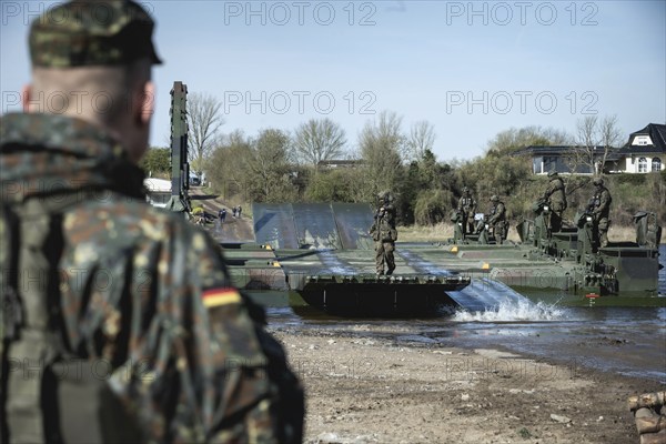 German soldiers of the NATO Response Force (NRF) train a water crossing with amphibious vehicles as part of the military exercise 'Wettiner Schwert' near Tangermünde, 26.03.2024. 'Wettiner Schwert' is part of the Quadriga exercise of the German Armed Forces and the NATO large-scale manoeuvre Steadtfast Defender 2024