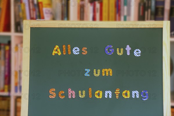 School blackboard with the inscription Happy first day at school