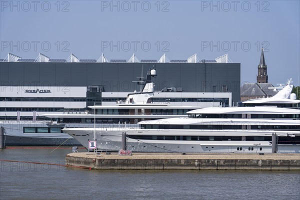 Oceanco shipyard in Alblasserdam, specialising in the construction of mega yachts, luxury yachts, on the river Noord, South Holland, in front the H3 yacht, 105 metres long, completely renovated, rebuilt, behind the superyacht Seven Seas Yacht, 109 metres long, owned by Steven Spielberg, Netherlands