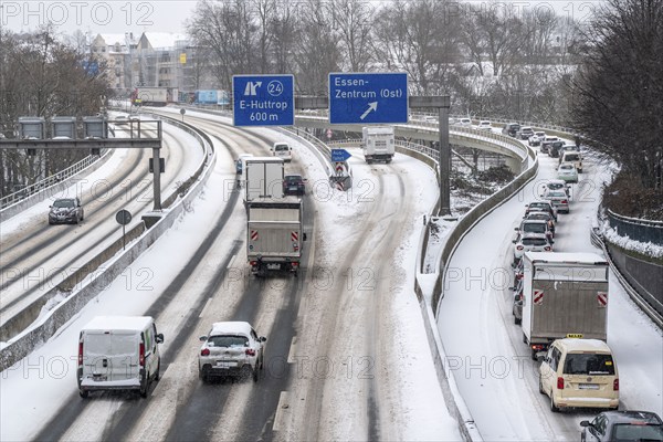 A40 motorway, onset of winter, lots of fresh snow and daytime temperatures below minus 5 degrees, uncleared road, little traffic, poor road conditions, Essen, North Rhine-Westphalia, Germany, Europe