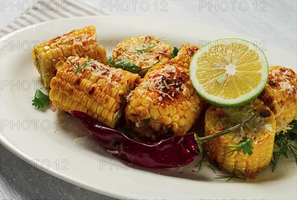 Grilled corn with spices, top view, no people, homemade