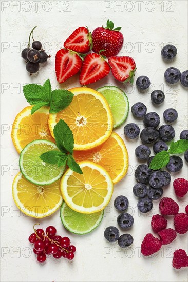 Mix of fruits and berries, set, assortment, sliced citrus fruits, raspberries, blueberries, mint leaves, strawberries, red currants, food background, fruit wallpaper