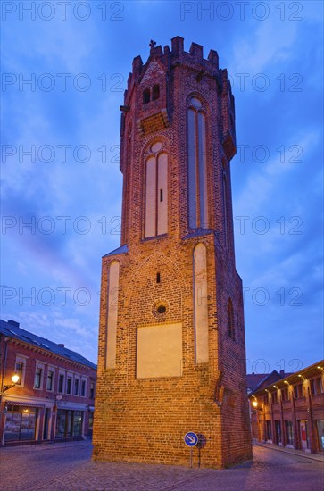 The brick Gothic Owl Tower, illuminated at night, in the old town centre of Tangermünde, Hanseatic town in the Altmark. Saxony-Anhalt, Germany, Europe