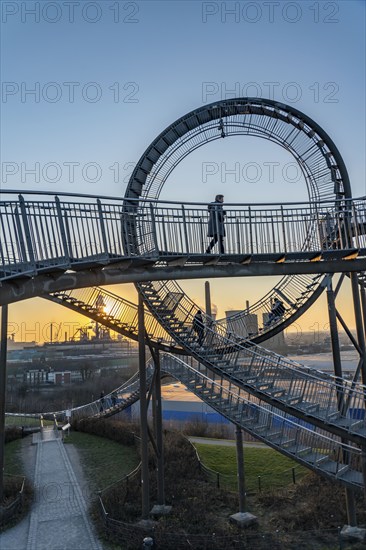 Landmark Angerpark Tiger & Turtle, Magic Mountain, walk-in sculpture in the form of a rollercoaster on the Heinrich-Hildebrand-Höhe spoil tip, HKM steelworks, sunset, Duisburg, North Rhine-Westphalia, Germany, Europe