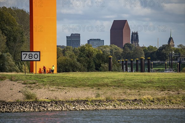 The sculpture Rhine Orange at the mouth of the Ruhr into the Rhine, skyline of the city centre of Duisburg, tower of the North Rhine-Westphalia State Archive, town hall tower and Salvator Church, North Rhine-Westphalia, Germany, Europe