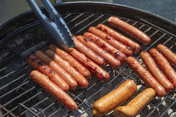 Detroit, Michigan, Hot dogs on the grill at the annual 'Summer Sizzler' picnic and party held by two Detroit Neighborhoods, Morningside and East English Village