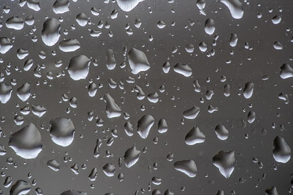 Rainy weather, raindrops on a window pane