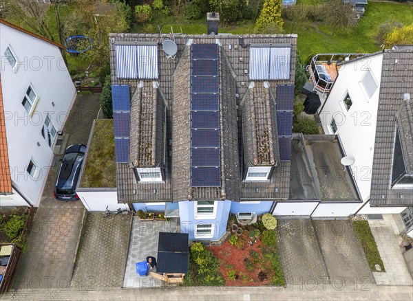 Detached house with various solar modules, in addition to normal standard solar panels, PV tube collectors are also installed, plug-in solar modules are mounted on a dustbin box as a roof, Essen, North Rhine-Westphalia, Germany, Europe