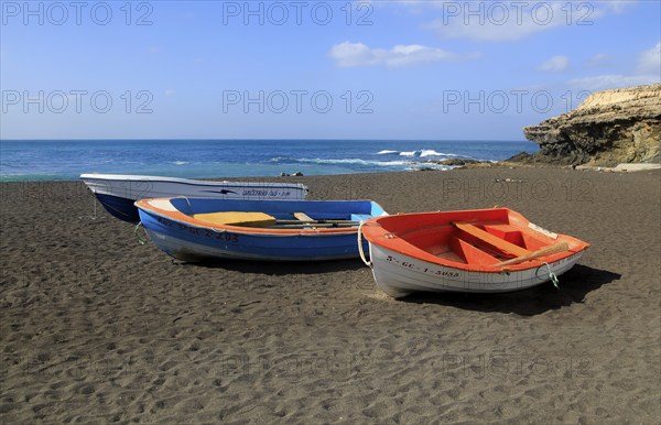 Colourful boats on black sand beach at Ajuy, Fuerteventura, Canary Islands, Spain, Europe