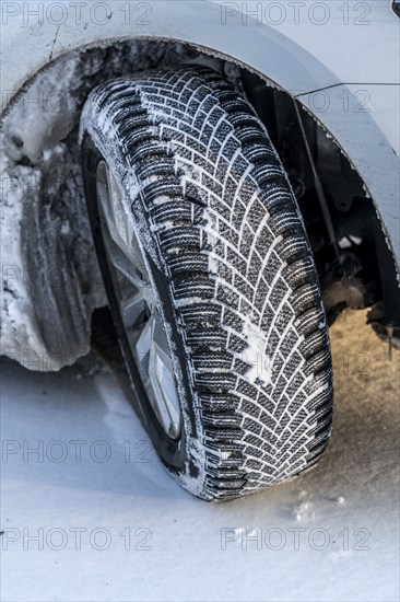 Winter tyres, driving on a road with snow cover, grip on the snow thanks to the special tread and rubber compound, the tyre for winter