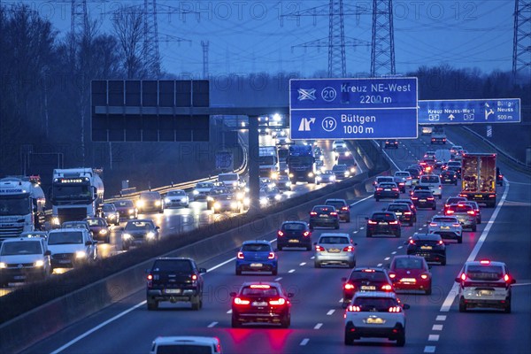 A57 motorway near Kaarst in the Rhine district of Neuss, view in the direction of the Büttgen junction, heavy evening traffic, overhead power lines, along the motorway, North Rhine-Westphalia, Germany, Europe