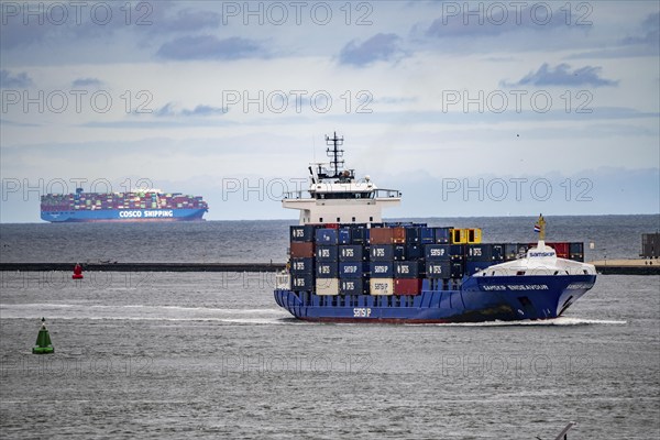 Entry to the seaport of Rotterdam, container freighter, feedership, Samskip Endeavour, enters the port of Rotterdam, Cosco Shipping Aries container ship departs, Nieuwe Waterweg, Netherlands