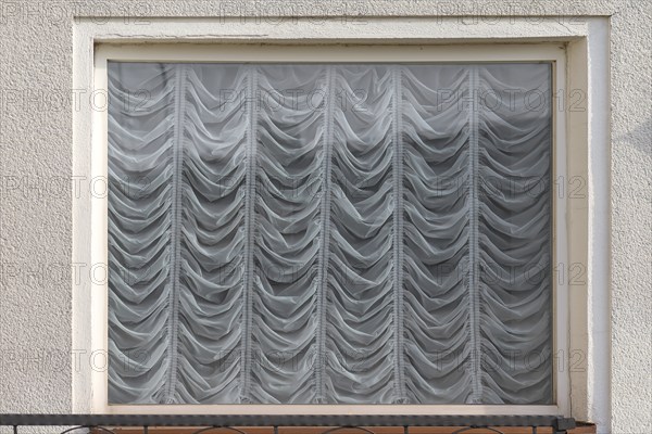 Draped curtains in a window, Bavaria, Germany, Europe