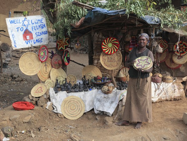 Amhara region, in the Falasha village of Wolleka near Gondar, Gonder, woman selling home-made souvenirs, Ethiopia, Africa