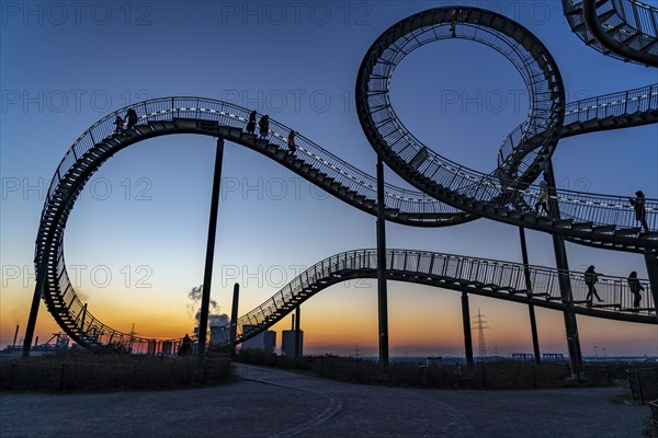 Landmark Angerpark Tiger & Turtle, Magic Mountain, walk-in sculpture in the form of a rollercoaster on the Heinrich-Hildebrand-Höhe spoil tip, HKM steelworks, sunset, Duisburg, North Rhine-Westphalia, Germany, Europe