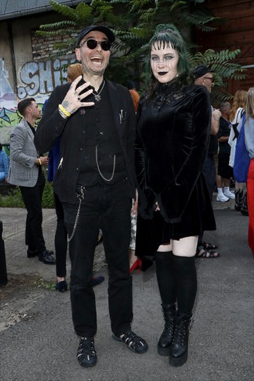 Mark Benecke and his woman Ines fisherman at the opening of the Tim Burton exhibition in the Radsetzerei on the RAW site in Berlin on 18 July 2024