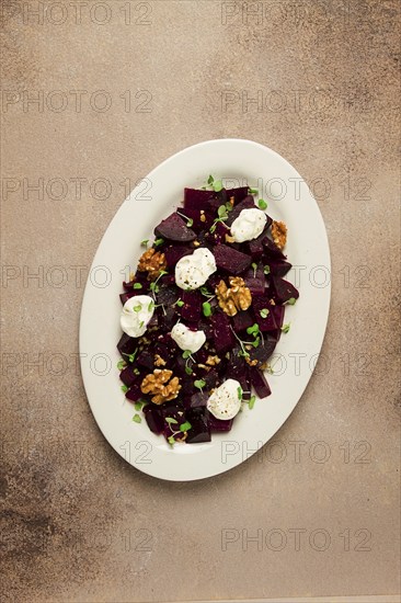 Beetroot salad with nuts, cream cheese and micro greenery, homemade, no people