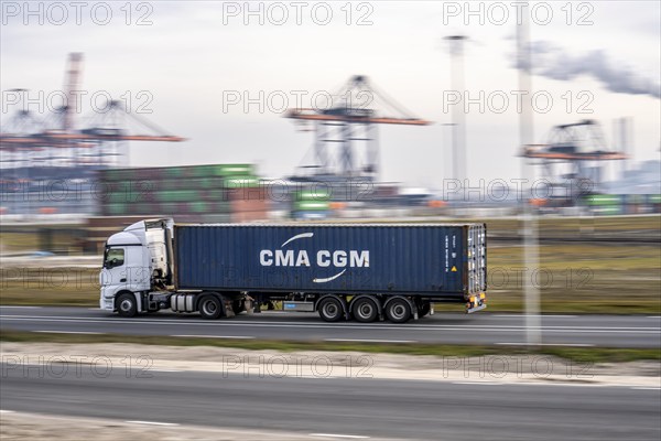 Container lorry, bringing containers to Euromax Container Terminal, the seaport of Rotterdam, Netherlands, deep-sea port Maasvlakte 2, on a man-made land area off the original coastline