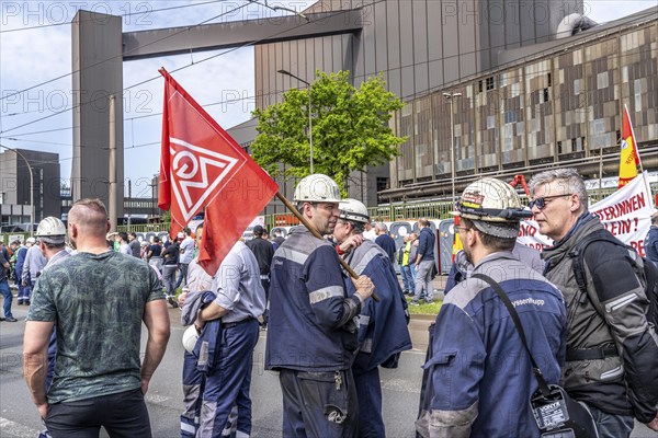 Steelworkers at a demonstration in front of the headquarters of ThyssenKrupp Steel Europe in Duisburg, against massive job cuts, after the participation of a foreign investor in the group, in the background the Oxygen steelworks, Duisburg North Rhine-Westphalia, Germany, Europe