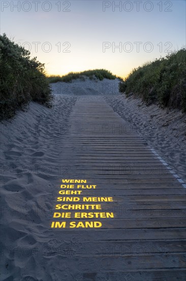 North Sea island Langeoog, beach access with luminous poem, light installation, When the tide goes out my steps are the first in the sand, Lower Saxony, Germany, Europe