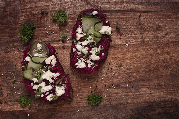 Sandwiches with beetroot hummus, cucumber and blue cheese, microgreens, rye bread, breakfast, homemade, no people