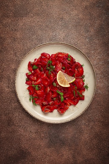 Salmon gravlax with beetroot, Scandinavian snack, beet gravlax, lightly salted fish, homemade, no people