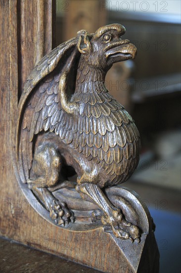 Carved wooden pew end figure, Huntingfield church, Suffolk, England, UK