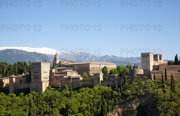 Snow capped peaks of the Sierra Nevada mountains and the Alhambra, Granada, Spain, Europe