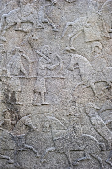 Detail of battle scene on the rear of the Aberlemno Kirkyard Cross Slab, a Pictish stone in Scotland, UK