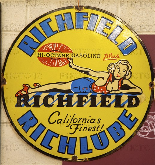 Vintage metal sign for Richfield Hi-Octane gasoline, Richlube, from California, USA, blonde woman model, North America