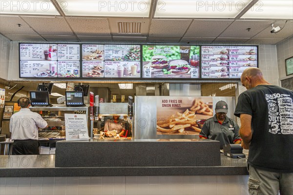 Customer ordering fast food in a Burger King restaurant