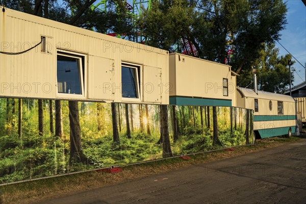 The Rhine fair in Düsseldorf, in the Rhine meadows in the Oberkassel district, on the Rhine, North Rhine-Westphalia, Germany, Decorated fence around the fairground containers, caravans, Europe