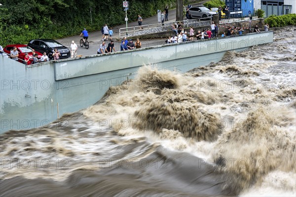 Weir of the Lake Baldeney in Essen, the masses of water roar through the open weirs, spectators, onlookers, high water on the Ruhr, after long heavy rains the river came out of its bed and flooded the landscape and villages, the highest water level ever measured, North Rhine-Westphalia, Germany, Europe