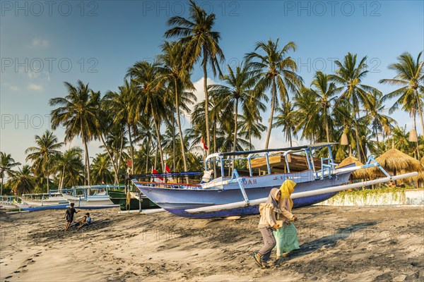 Muslim woman in the evening sun at Mangsit beach in Sengiggi, boat, fishing boat, palm beach, youth, Islam, religion, headscarf, travel, tourism, sea, ocean, island, coast, tropical, tropics, Asian, natural landscape, untouched, tourism, holiday, lonely, deserted, tranquillity, authentic, authenticity, original, atmosphere, holiday mood, long-distance travel, tradition, traditional, poverty, culture, tradition, holiday idyll, Lombok, Indonesia, Asia